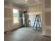 Unfinished room with water heater and ladder; ready for personalization at 5205 Mint Harbor Way # 0353, Charlotte, NC 28269