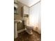 Traditional bathroom featuring a pedestal sink, tiled floor, and a classic white color palette at 601 Meadowbrook Rd, Kings Mountain, NC 28086