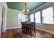 Charming dining room featuring a decorative chandelier, windows for natural light, and an oriental rug at 601 Meadowbrook Rd, Kings Mountain, NC 28086
