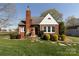 Charming brick home with manicured lawn, stone accents, and a distinctive chimney and front yard at 601 Meadowbrook Rd, Kings Mountain, NC 28086