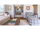 Cozy living room showcases hardwood floors, white walls, and doorway views into the playroom and other areas at 601 Meadowbrook Rd, Kings Mountain, NC 28086