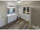Freshly renovated bathroom with modern fixtures, a bright window, and a clean, inviting design at 614 Normandy Rd, Lancaster, SC 29720