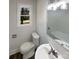Updated bathroom featuring modern fixtures, a bathtub, a sink with vanity, and a bright window at 614 Normandy Rd, Lancaster, SC 29720