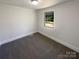 Clean and bright bedroom with a large window, providing ample natural light and a view of the outdoors at 614 Normandy Rd, Lancaster, SC 29720
