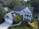 An aerial view of a two-story home with a two car garage at 6325 Hawkwood Ln, Charlotte, NC 28277