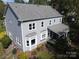 Aerial view of the back exterior of a two-story home with a porch at 6325 Hawkwood Ln, Charlotte, NC 28277