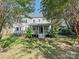 A backyard with a raised porch and beautiful trees at 6325 Hawkwood Ln, Charlotte, NC 28277