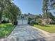 Two-story home with a long driveway and an attached garage at 6325 Hawkwood Ln, Charlotte, NC 28277