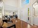 Spacious foyer with hardwood floors, stylish decor, and double doors leading to the living areas at 6325 Hawkwood Ln, Charlotte, NC 28277