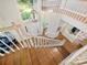 Foyer with hardwood floors, white staircase, overhead chandelier, and view to front door at 6325 Hawkwood Ln, Charlotte, NC 28277