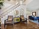 Grand foyer with hardwood floors, staircase, stylish furniture, and elegant decor creating a welcoming entrance at 6325 Hawkwood Ln, Charlotte, NC 28277