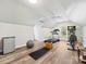 Home gym features laminate floors, weight equipment, and natural light at 6325 Hawkwood Ln, Charlotte, NC 28277