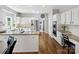Bright kitchen featuring granite countertops, stainless steel appliances and white cabinetry at 6325 Hawkwood Ln, Charlotte, NC 28277