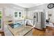 Charming kitchen with granite counters, stainless steel appliances, and ample natural light at 6325 Hawkwood Ln, Charlotte, NC 28277