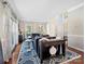 Bright living room with hardwood floors, large windows, and stylish blue furnishings at 6325 Hawkwood Ln, Charlotte, NC 28277