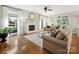 Bright living room boasts hardwood floors, fireplace, neutral tones and lots of natural light at 6325 Hawkwood Ln, Charlotte, NC 28277
