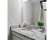 Bathroom vanity with granite countertop, stylish fixtures, and decorative mirror create a welcoming space at 6354 Old Pineville Rd # F, Charlotte, NC 28217