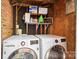 Equipped with modern LG washer and dryer, the functional laundry area also includes storage shelves at 6354 Old Pineville Rd # F, Charlotte, NC 28217