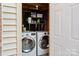 Efficient laundry area equipped with a washer and dryer inside storage area at 6354 Old Pineville Rd # F, Charlotte, NC 28217