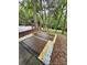 Landscaped backyard features a brick patio and surrounding mulch for a clean aesthetic at 6614 Old Providence Rd, Charlotte, NC 28226
