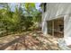 Backyard featuring a patio area, lush greenery, and a glimpse of the home's exterior at 6614 Old Providence Rd, Charlotte, NC 28226