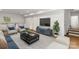 Staged basement including stylish furniture, a large TV, and a decorative wet bar area at 6614 Old Providence Rd, Charlotte, NC 28226