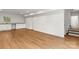 Spacious basement with luxury vinyl plank flooring, a wet bar, and access to upper levels of the home at 6614 Old Providence Rd, Charlotte, NC 28226