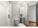Stylish bathroom with a pedestal sink and walk-in shower at 6614 Old Providence Rd, Charlotte, NC 28226