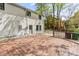 Large deck area, with a white brick home exterior in the background at 6614 Old Providence Rd, Charlotte, NC 28226