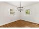Bright and open dining room space with wood floors and modern lighting at 6614 Old Providence Rd, Charlotte, NC 28226