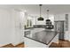 Modern kitchen with white cabinets, stainless steel appliances, and quartz countertops at 6614 Old Providence Rd, Charlotte, NC 28226