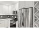 Modern kitchen with stainless steel appliances and white cabinets at 6614 Old Providence Rd, Charlotte, NC 28226