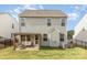 Rear view of a home featuring a covered patio and fenced yard at 7394 Echoing Hills Ln, Maiden, NC 28650