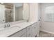 Bright bathroom features double sinks, a large mirror, and tiled flooring at 7394 Echoing Hills Ln, Maiden, NC 28650