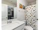 Bathroom featuring a white vanity, matching toilet, and a shower with a colorful dinosaur curtain at 7394 Echoing Hills Ln, Maiden, NC 28650