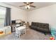 Bright, carpeted bedroom featuring a ceiling fan and furnished with toys and a gray futon at 7394 Echoing Hills Ln, Maiden, NC 28650