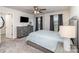 Bedroom featuring a ceiling fan, carpet, tv, and a gray dresser at 7394 Echoing Hills Ln, Maiden, NC 28650