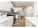 Bright kitchen with white cabinetry, stainless steel appliances, and stone countertops at 7394 Echoing Hills Ln, Maiden, NC 28650