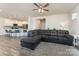 Inviting living room featuring a comfortable grey sectional sofa, hardwood floors, and an open concept floor plan at 7394 Echoing Hills Ln, Maiden, NC 28650