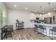 Bright living area with modern kitchen, hardwood floors, and a dining area at 7394 Echoing Hills Ln, Maiden, NC 28650