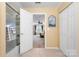 Bathroom with shower over tub, ensuite bedroom, and linen closet at 744 Ledgestone Ct, Tega Cay, SC 29708