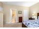 Bedroom featuring comfortable sleeping area with easy access to an ensuite bathroom and closet at 744 Ledgestone Ct, Tega Cay, SC 29708