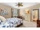 Bedroom featuring comfortable sleeping area with an armoire and easy access to an ensuite bathroom at 744 Ledgestone Ct, Tega Cay, SC 29708