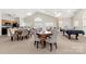 Well-appointed clubhouse featuring tables, chairs, a kitchenette, and a billiard table at 744 Ledgestone Ct, Tega Cay, SC 29708
