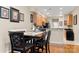 Breakfast nook with wood floors, table, and kitchen view, offering a casual dining experience at 744 Ledgestone Ct, Tega Cay, SC 29708