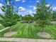 Lush green space featuring a walking path and gazebo-covered seating area at 744 Ledgestone Ct, Tega Cay, SC 29708