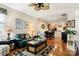 Open-concept living room flowing into dining area with hardwood floors and natural light at 744 Ledgestone Ct, Tega Cay, SC 29708
