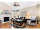 Inviting living room with a fireplace, high ceilings, hardwood floors, and cozy decor at 744 Ledgestone Ct, Tega Cay, SC 29708