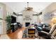 Bright living room with a fireplace, vaulted ceilings, and comfortable seating arrangement at 744 Ledgestone Ct, Tega Cay, SC 29708