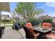 Outdoor patio featuring a dining table, chairs, and a view of the surrounding neighborhood at 744 Ledgestone Ct, Tega Cay, SC 29708